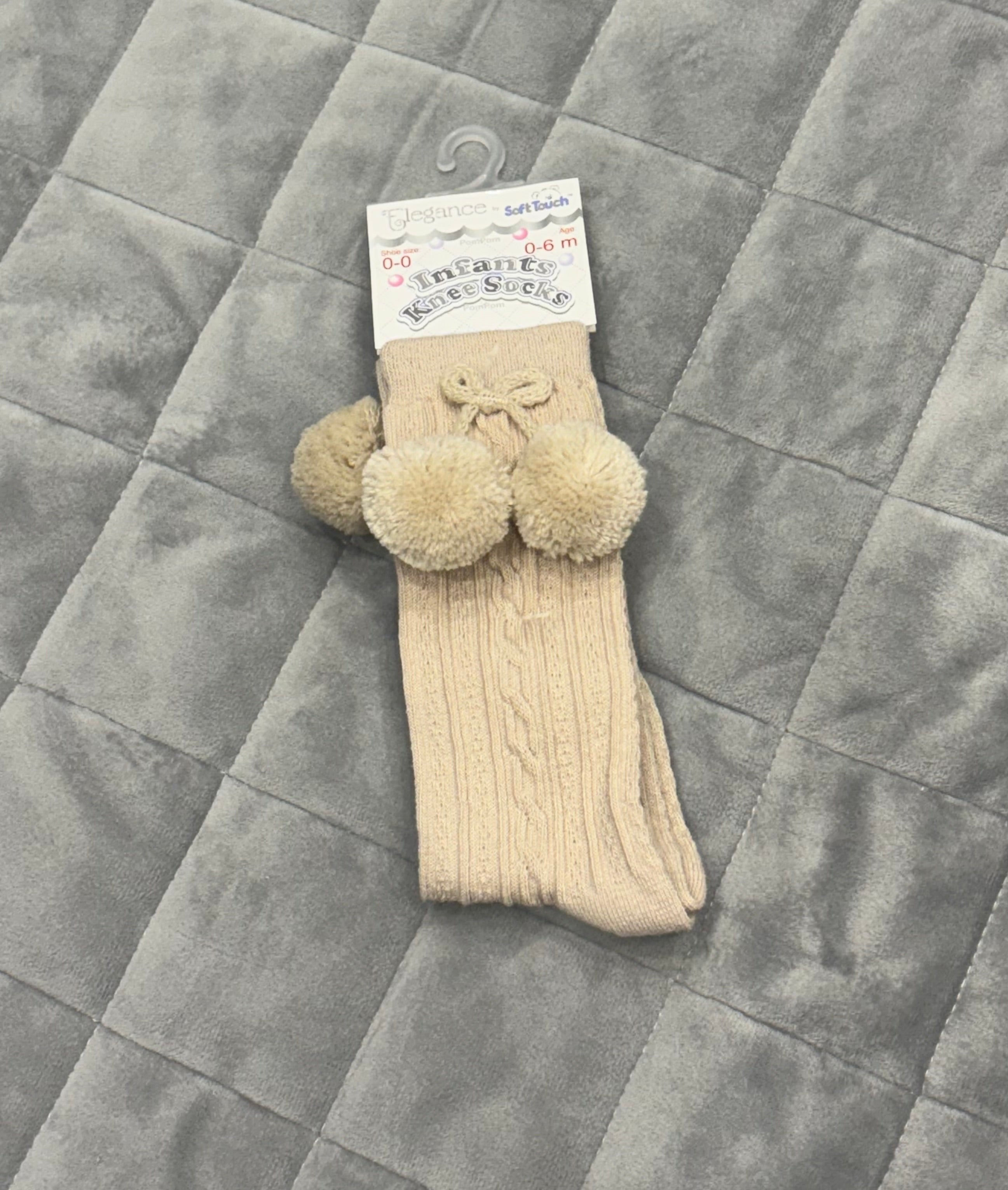 Beige knee high pom pom socks