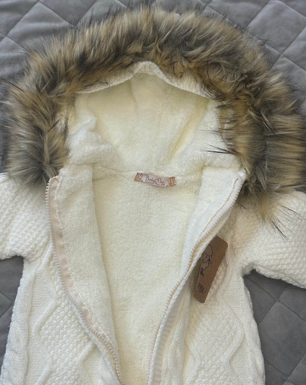 Cable knit fur lined hooded romper with fur trim hood