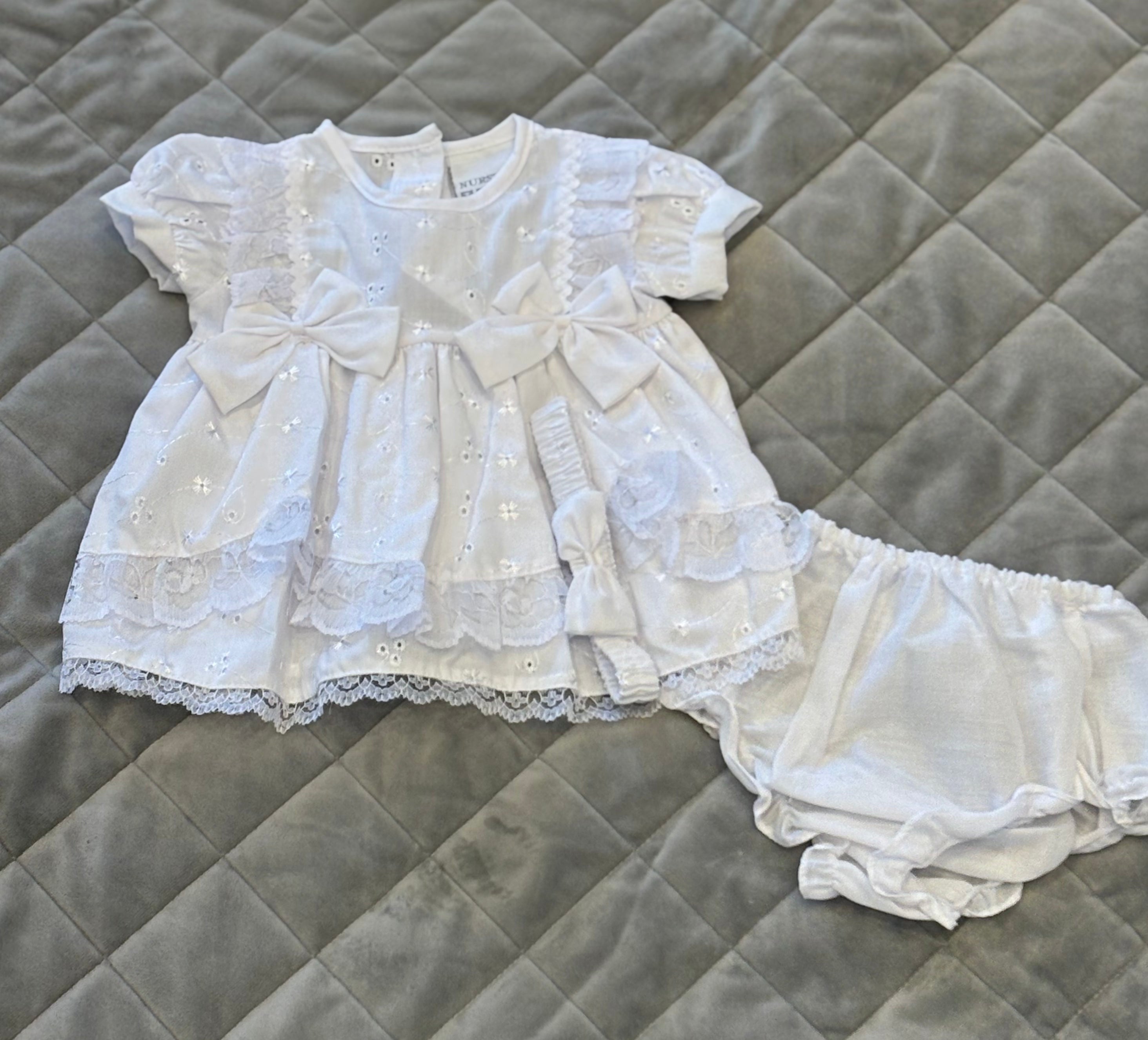 White frill and bow dress with matching headband
